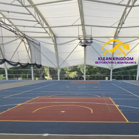 Basketball court cleaning at a private college, Sydney's north shore. Careful, paint-safe process to remove chewing gum and lift stains without damaging the court surface — extending time between repaints. Covered basketball court soft-wash cleaning at a private college in Sydney's north — chewing gum and stain removal by Klean Kingdom